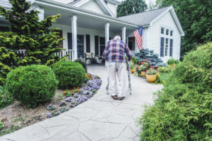 Elderly Merced Man Walking Up the Path to the Front Door