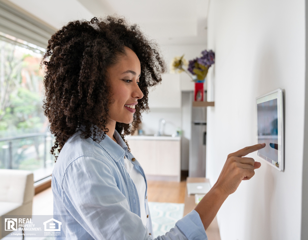 McQueeney Woman Adjusting Home Security System