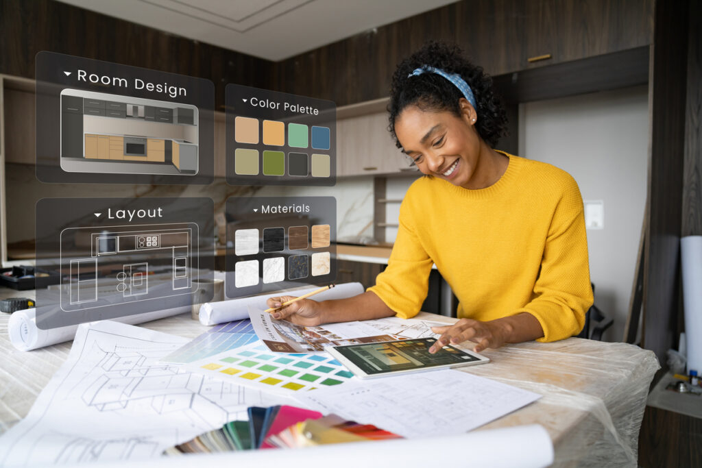Interior designer remodeling a kitchen and using interactive screens while working