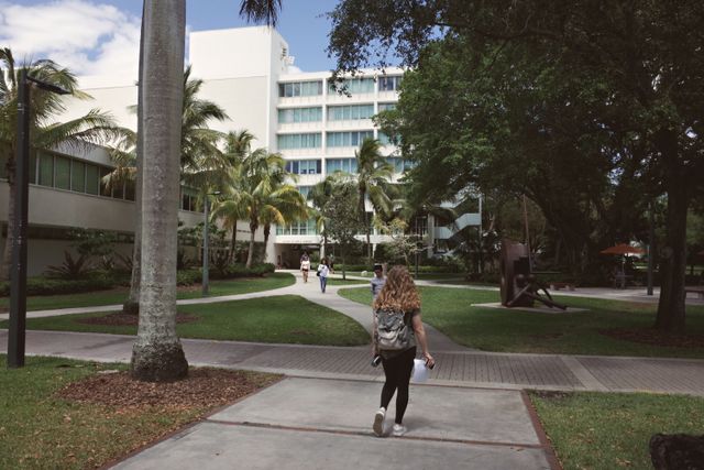 people walking through a campus