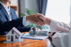 Agent presented client with an investment opportunity involving sale of property, discussing mortgage loan, home insurance, and business contract details. insurance, sale, business, agent, contract.