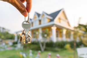 lease, rental and selling home. Real estate agent manager smile holding key for new owner. rent house, Sales, loan credit financial, insurance, Seller, dealer, installment, buy, sell, move in