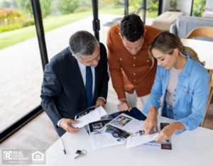 A couple reviews types of investments with their property manager.