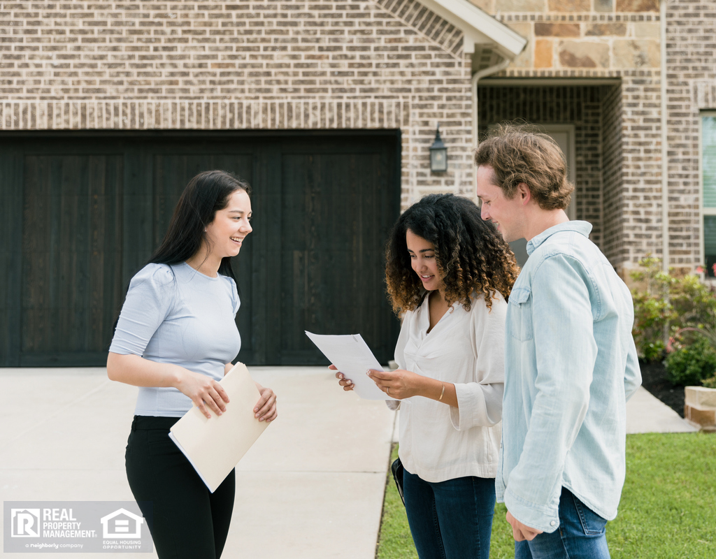 Pasco Property Manager Talking to Rental Owners Outside the Property