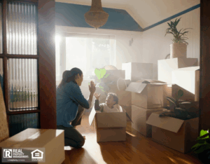 Son and mother high five in new home with boxes.