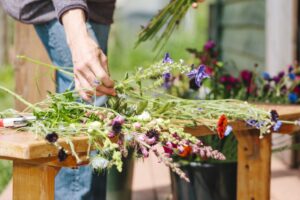 A local urban forager makes bouquets of wild flowers