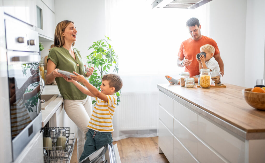 A happy family in their new kitchen. This picture brings to life the warmth and joy of a family moment in their new home