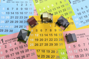 A vibrant assortment of house numbers arranged on a calendar, showcasing various colors and styles. 

