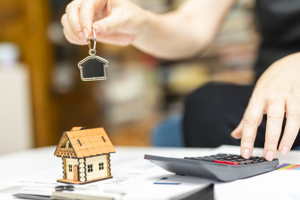 Property manager hands out keys to tenants after signing the lease.