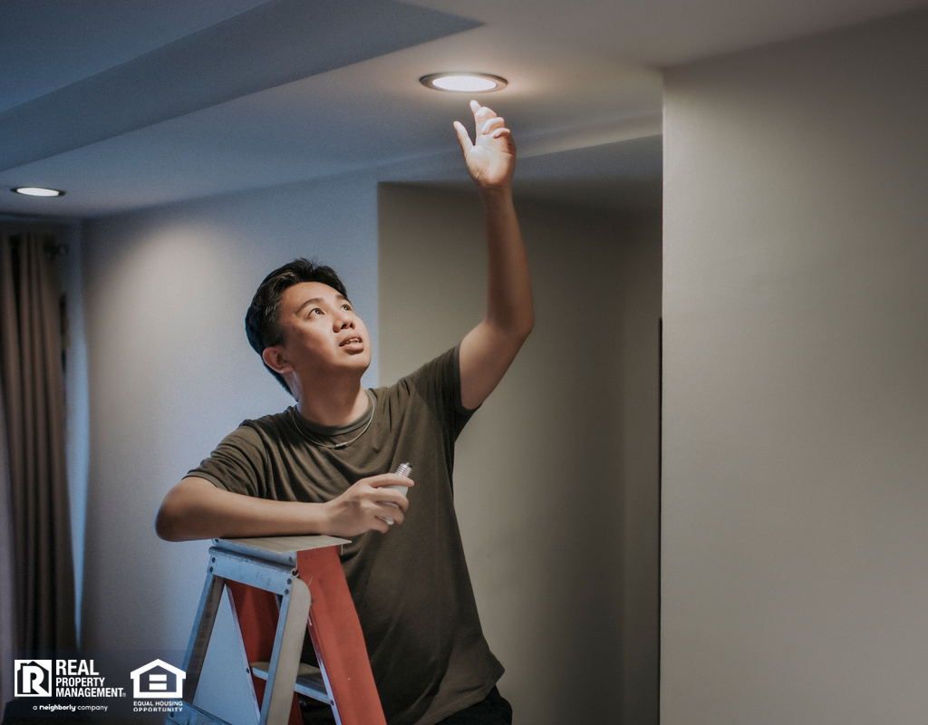 Westborough Tenant Changing a Lightbulb
