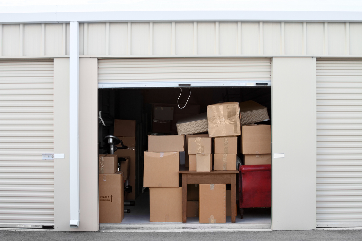 A Storage Unit Filled Completely with Boxes and Furniture