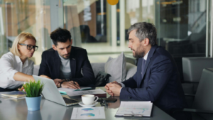 eam of professionals having a business meeting in a modern office space