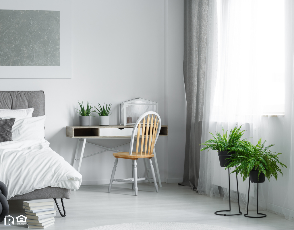 Pristine Bedroom with A Pair of Ferns by the Window