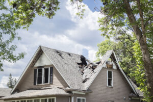 Close up image of a roof of a house that has burned and fallen in.