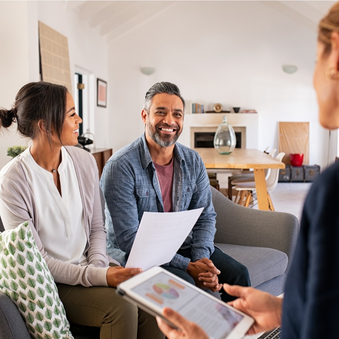 Couple Talking to a Financial Advisor at Home