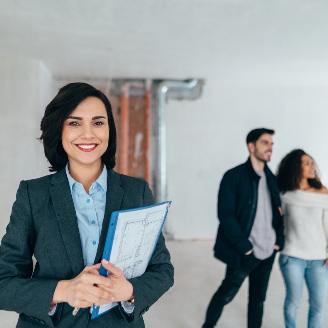 Real Estate Agent Showing New Home to Clients
