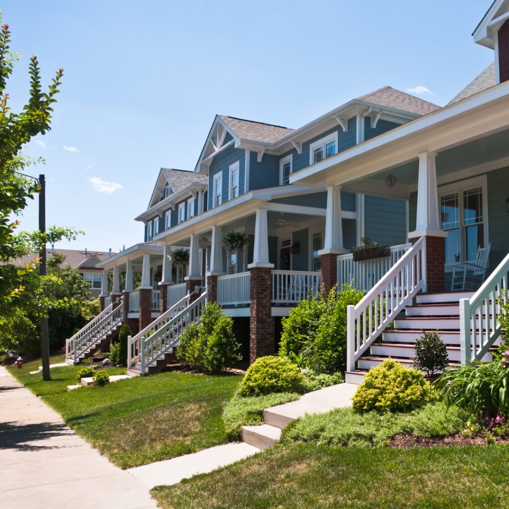 A new upscale neighborhood of single family homes on quiet tree lined streets near Raleigh, North Carolina feature an updated version of the classic Bungalow style home with wide front porches