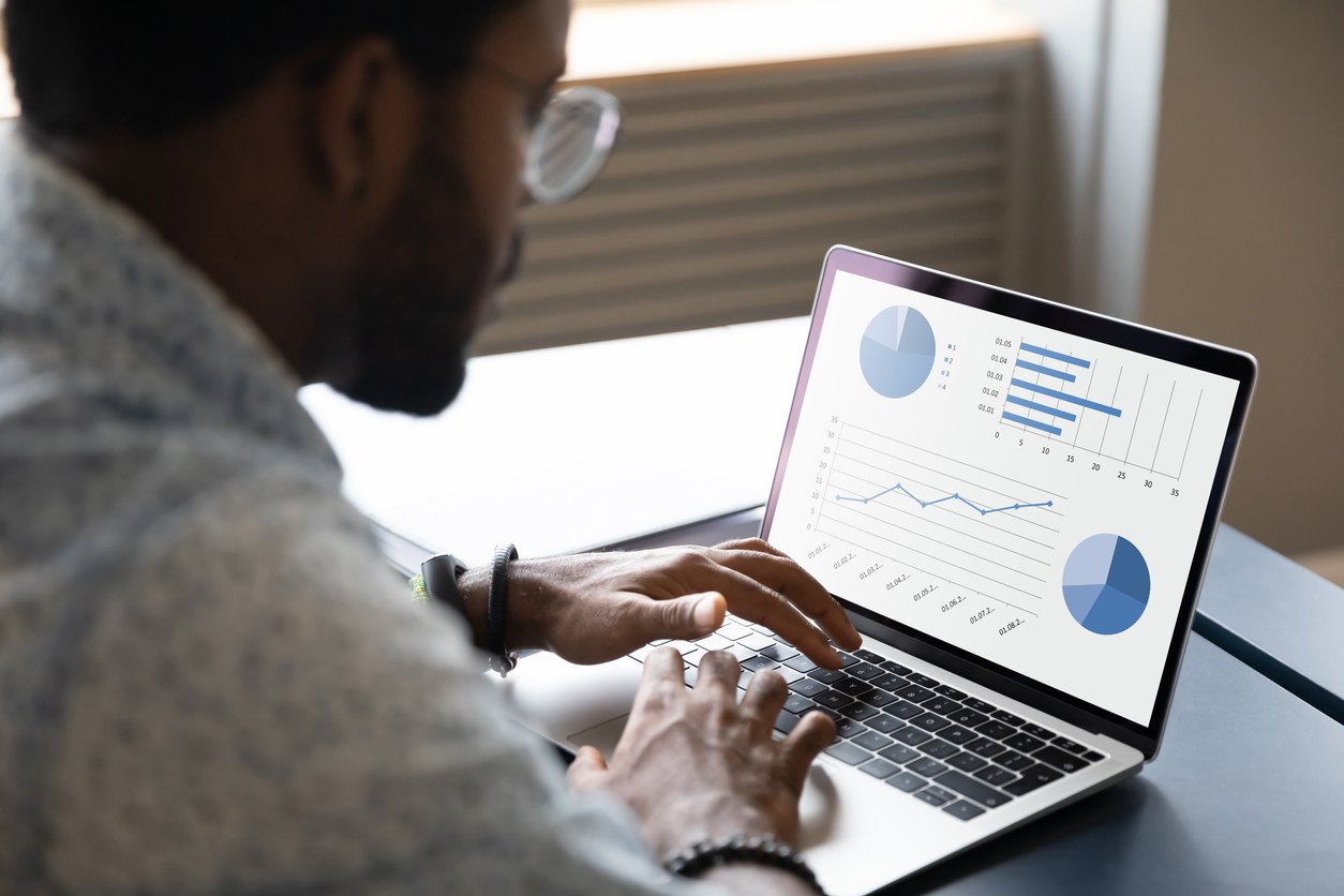 Provo Real Estate Investor Reviewing Data on a Laptop