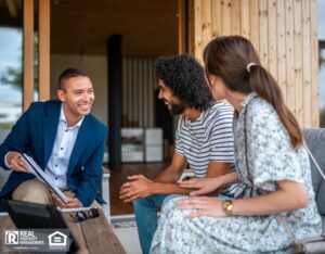 A man and woman discuss their options with a property manager in an office setting.