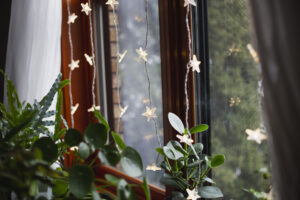 Star shaped string lights hanging in a window