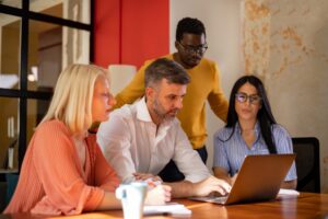 Diverse group of real estate professionals in their office, working and brainstorming.