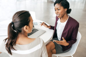 Two Business Women Making an Investment Decision 