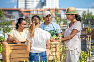 Group of people on the rooftop learning urban gardening.