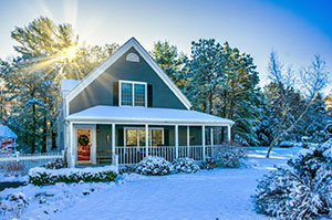 Cozy Home Covered in Snow on Sunny Winter Day