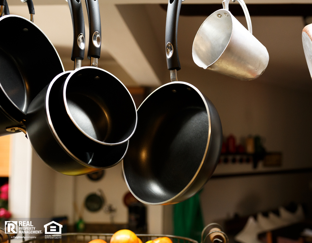 Pots Hanging from a Rack in the Kitchen of a Beebe Rental Home