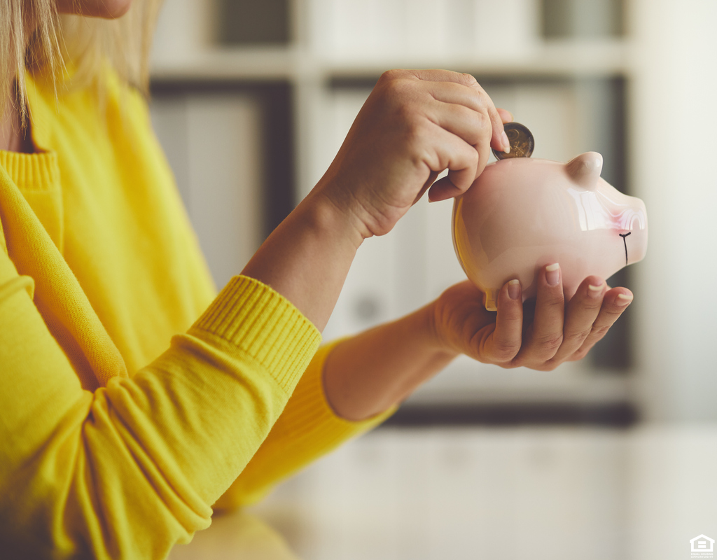 St Cloud Woman Saving Change in a Piggy Bank