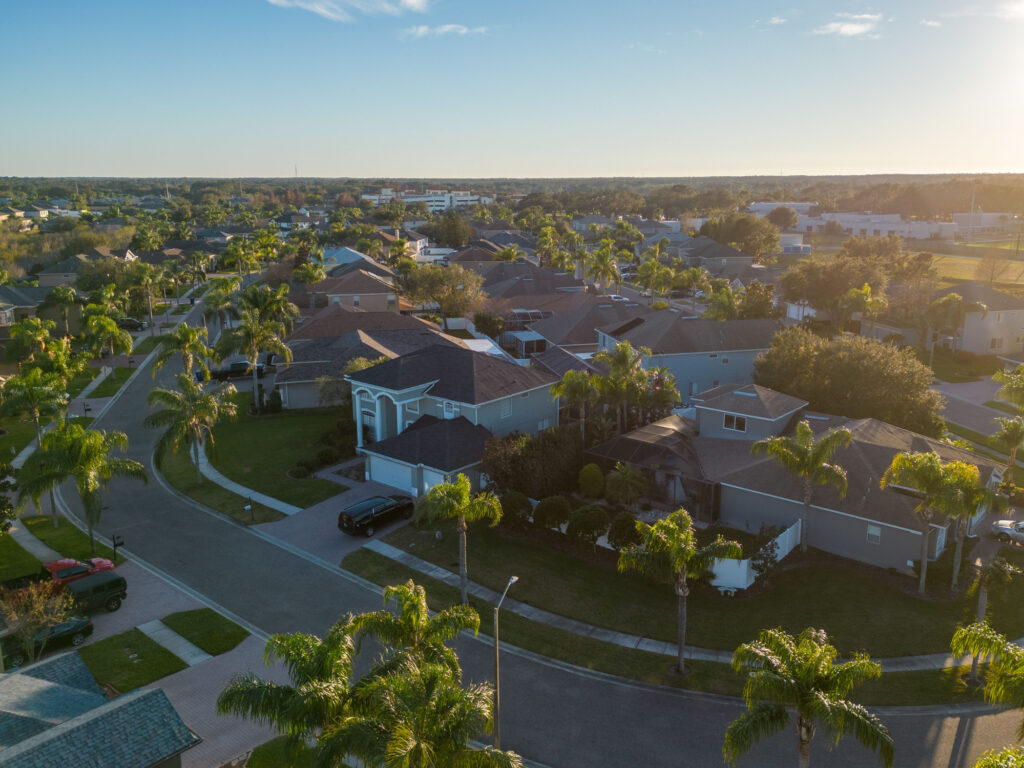 A drone shot of neighborhoods with palm trees near Tampa, Florida, USA