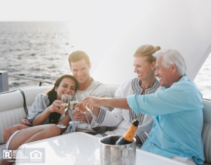 Two generational family celebrating with champagne on yacht