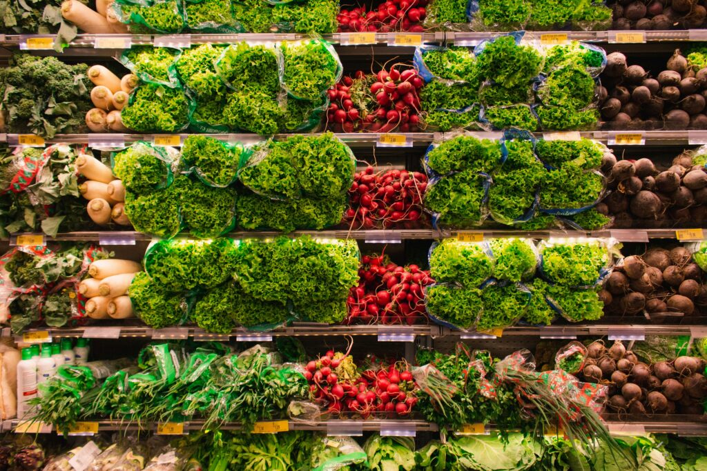grocery store shelf full of produce.