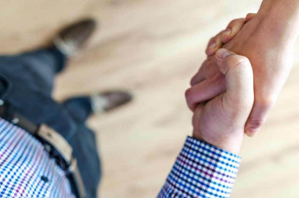 an-over-head-shot-of-two-people-shaking-hands
