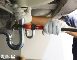 Local Plumber Fixing the Sink at a Pflugerville Rental Property