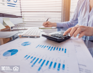 Bowling Green Property Owner Making Calculations at a Desk