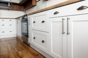 Stylish Gray Fixtures on White Kitchen Cabinets