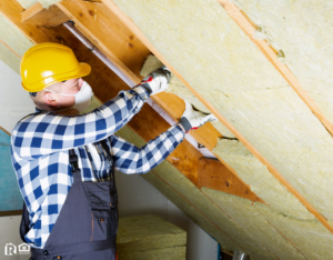 Maintenance Man Working on Insulation in the Attic of a Killeen Rental Home
