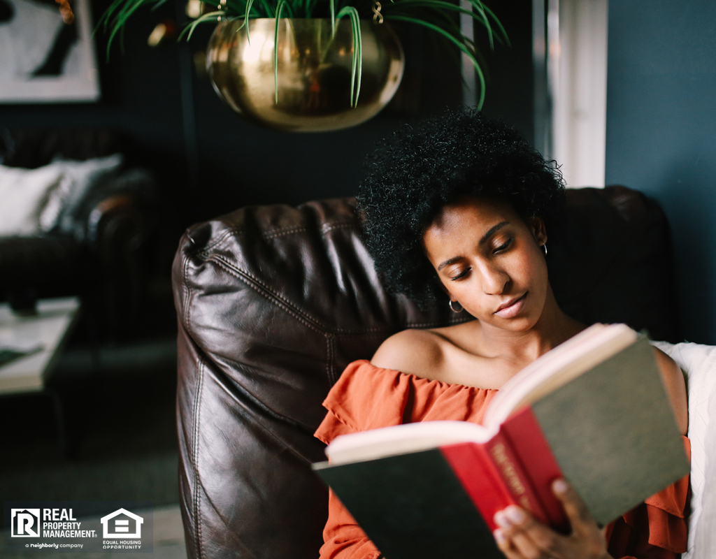 Woman Relaxing in Her College Station Reading Nook