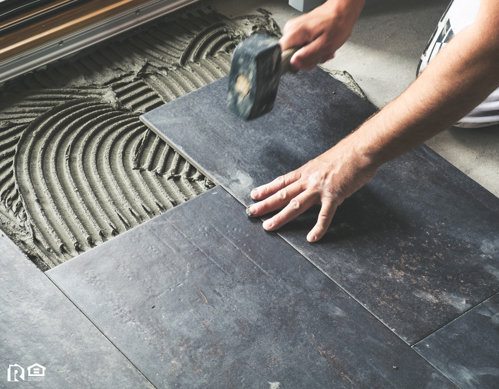 Elkhorn Man Placing New Tile in his Dream Bathroom