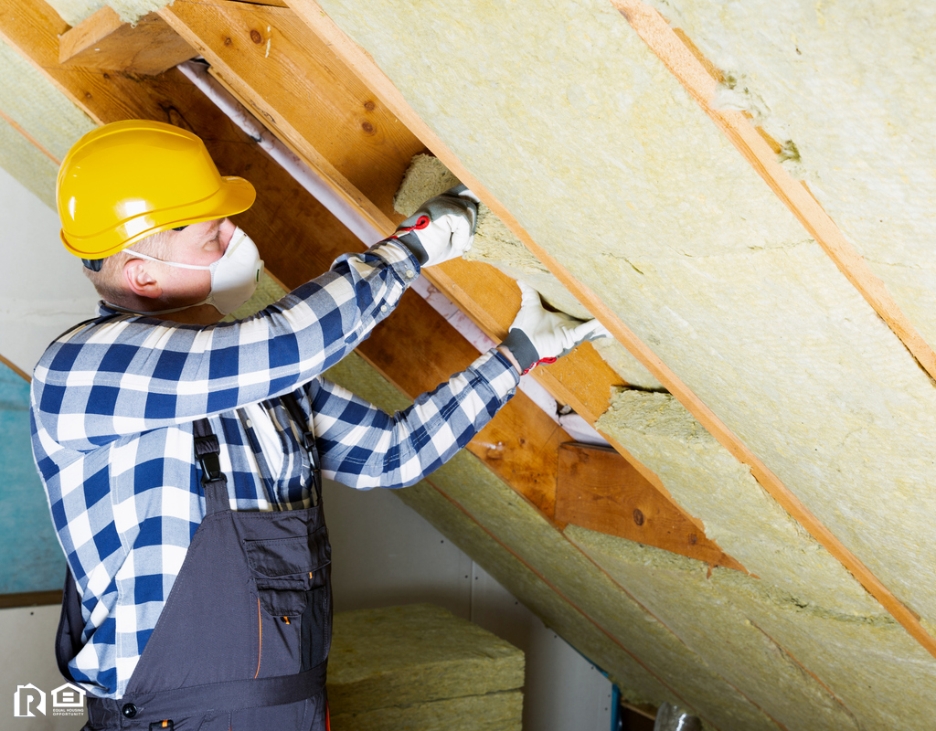 Maintenance Man Working on Insulation in the Attic of a Newbury Park Rental Home