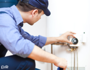 Man Fixing a Water Heater in Newburgh Rental Property