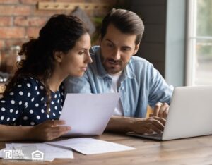 Couple reviewing tenant applications.