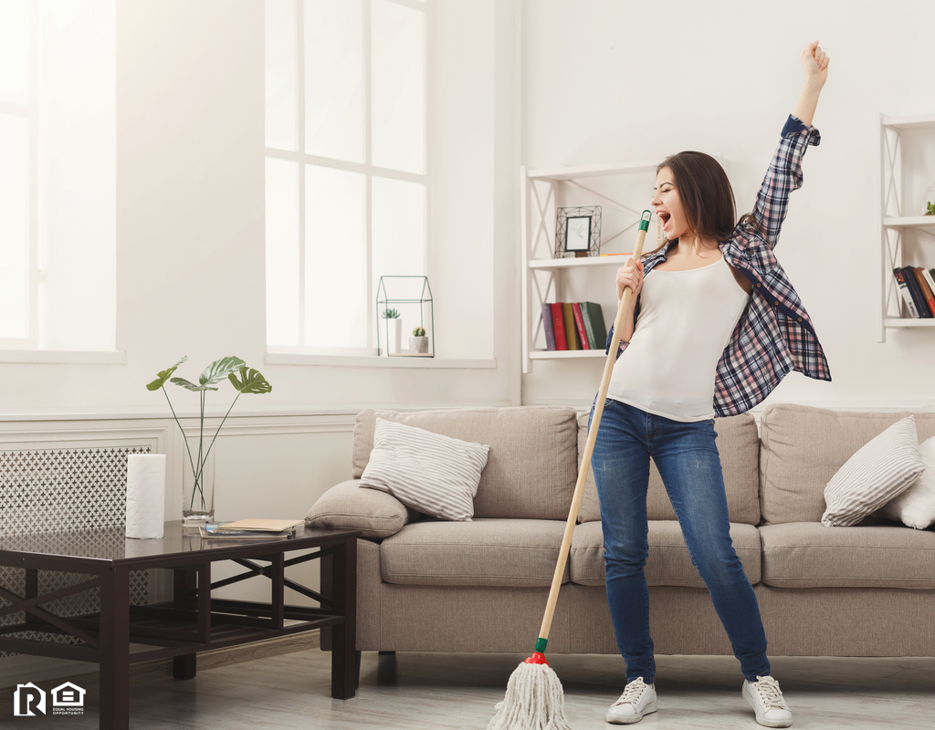 Estero Woman Tidying the Living Room