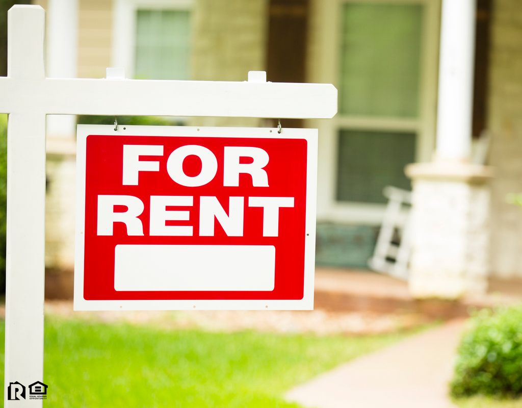 Humble Rental Property with a “For Rent” Sign in the Front Yard