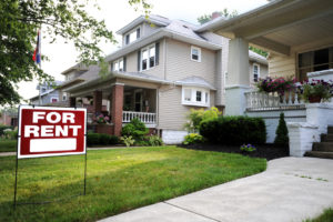 Home For Rent Sign in Front of Beautiful American Home