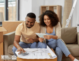 Couple in their new home reviewing budgeting related to property upkeep and maintenance.