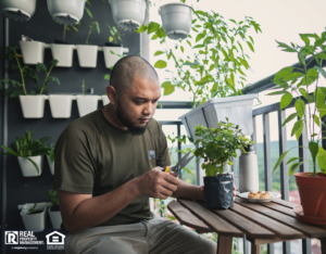 Bangor Tenant Tending his Balcony Garden