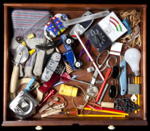 Birdseye View of a Messy Junk Drawer Full of Random Items