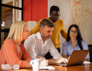 Diverse group of real estate professionals in their office, working and brainstorming.